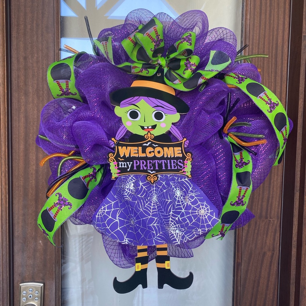 Halloween wreath. Frame is 15 inches wide but we mesh it makes it about 24 in